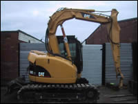 Caterpillar 308C Damaged main arm engine and bonet, following a bridge collision during transport